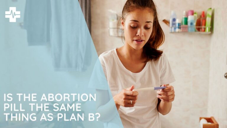 woman looks at pregnancy test