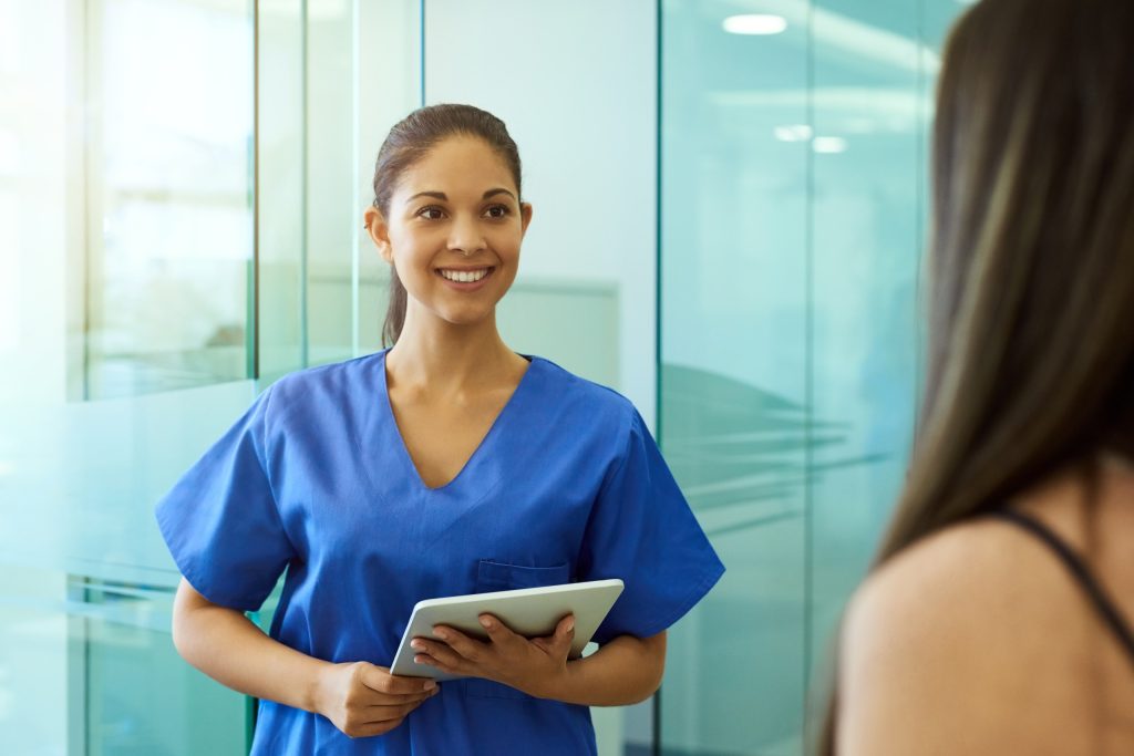 female nurse discussing options with young woman