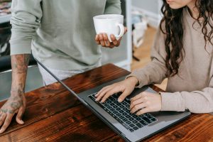 woman and man research missed period pills using the computer